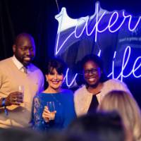 President Mantella poses with two grads holding glasses at Toast